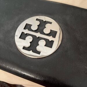 Tory Burch Black Leather Clutch with Silver Emblem like new